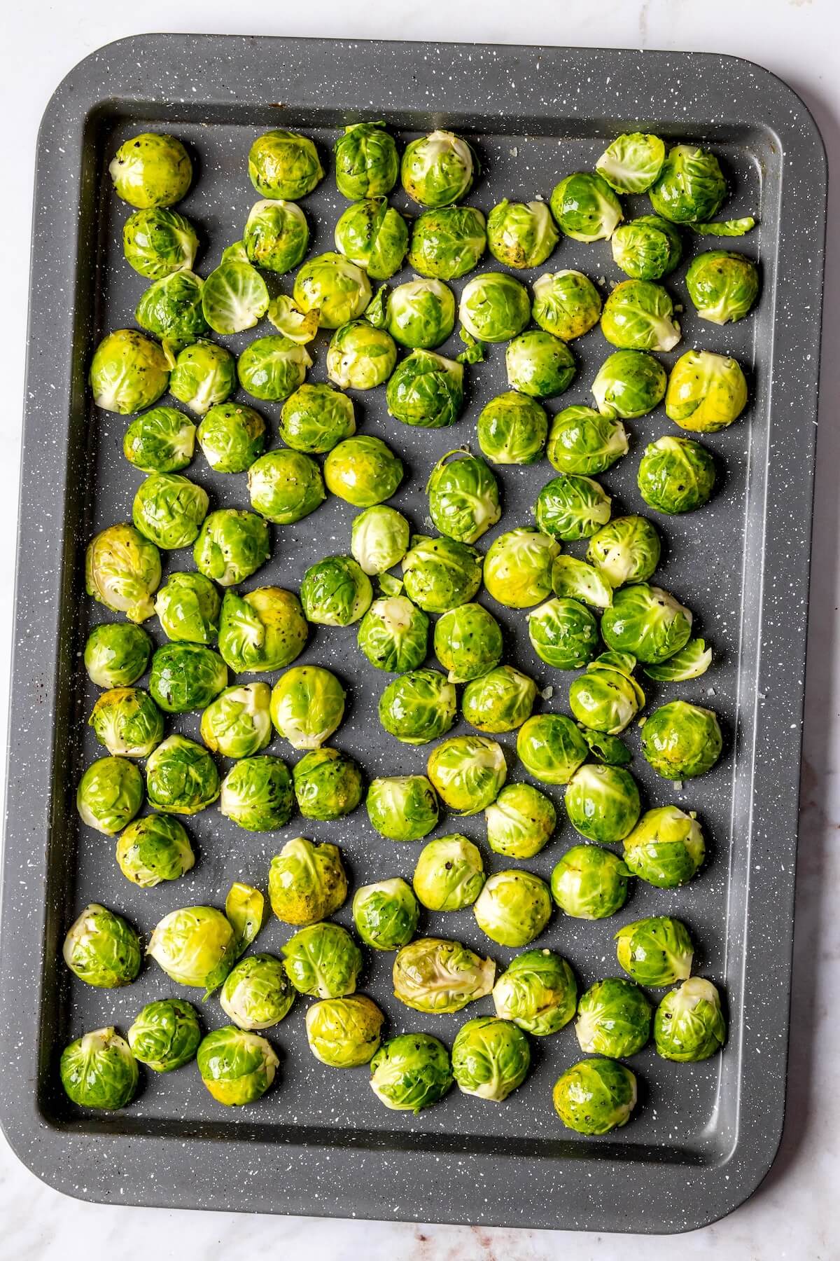 How to Make Crispy Baked Brussels Sprouts Step 2 - Olivia Adriance