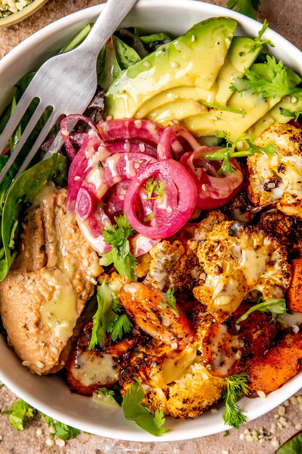 Roasted Veggie Hummus Bowl with Roasted Garlic Sauce - Olivia Adriance