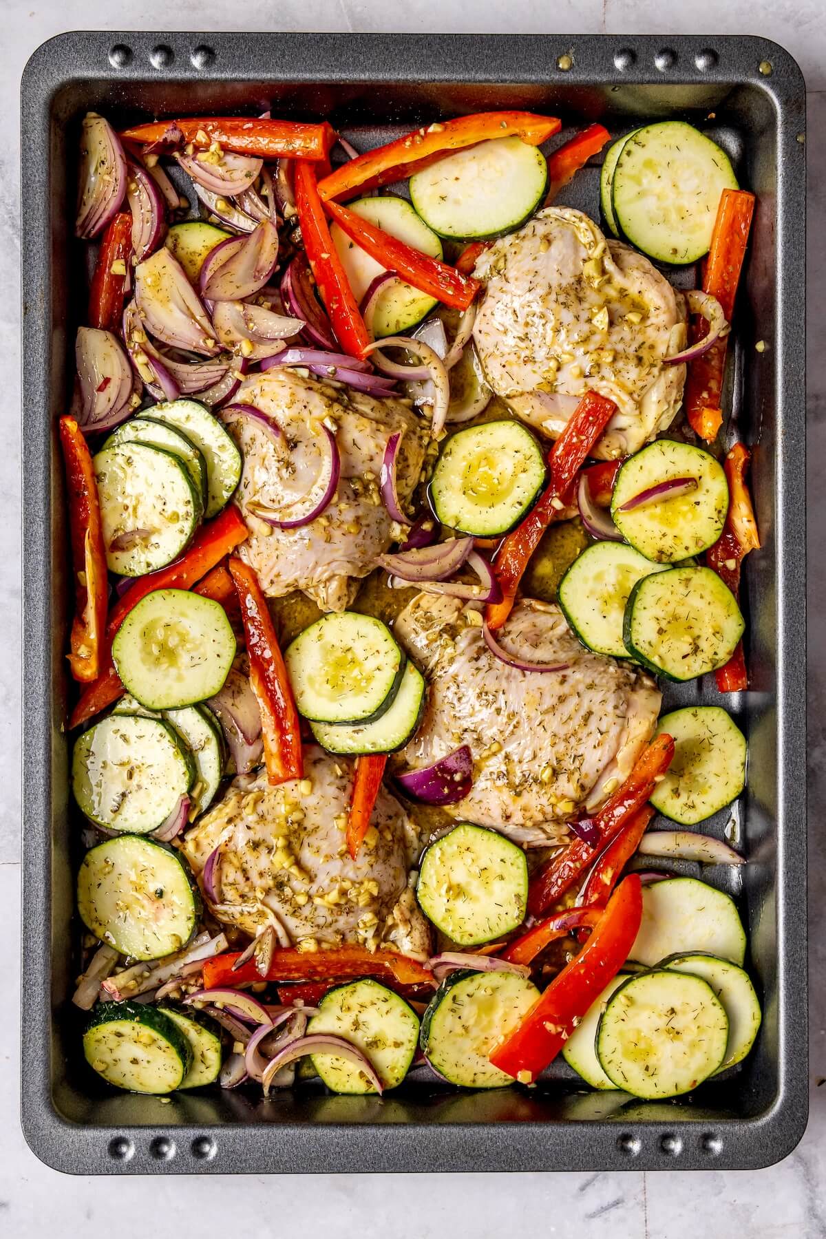 How to Make Sheet Pan Greek Chicken and Veggies Step 5 - Olivia Adriance